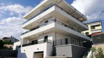 Modern exclusive new building in Kostrena just 300 meters from the sea - ground floor apartment with garden 400m2, apartment 42m2 and garage 100m2 