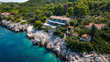 Two modern villas on an isolated island near Dubrovnik which can be united into a single villa with 422 m2 surface and 5656 m2 land plot 