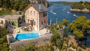 Unique lighthouse-type isolated property with private pier in Sibenik area 