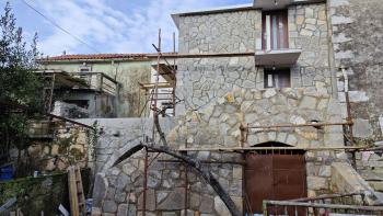 Renovated stone house in a row in the city of Krk 