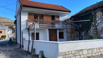 A house with a garage and a large yard in a great location in Rijeka! 