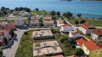 Investment project - land plot with valid building permit and finished basement just 80 meters from the sea 