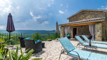 Two stone properties with a swimming pool in Oprtalj with a view of Motovun 