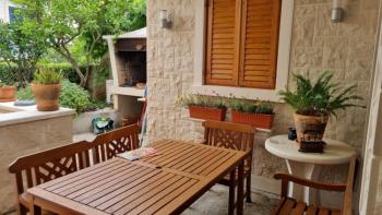 Apartment with wonderful garden in Postira on Brac island 150 meters from the sea 