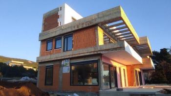 Two modern houses under construction in the second row to the sea in Stara Novalja, Pag 