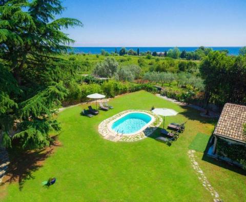 Beautiful villa in Umag outskirts just 250 meters from the sea across green lawns 