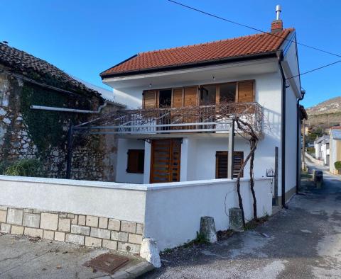 A house with a garage and a large yard in a great location in Rijeka! 