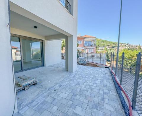 Apartment with a garden in a new building in the center of Opatija with a garage, sea view - pic 11