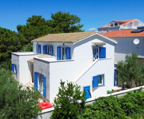 House with 2 apartments on Pag, mere 50 meters from the sea 