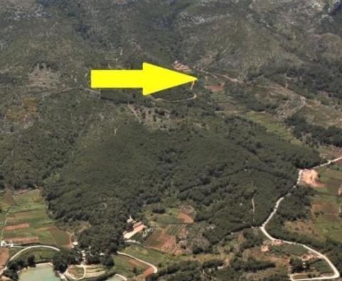 Agricultural land plot for sale 24.000 sqm with a 60 sqm stone object in Jelsa area on Hvar island 