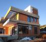 Two modern houses under construction in the second row to the sea in Stara Novalja, Pag 