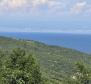 Building land with a beautiful view of the sea, ideal for building two villas in Rabac area 