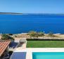 Three- bedroom apartment in a new building on Pag peninsula in Povljana, 1st row to the sea 